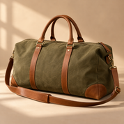 one premium olive canvas weekender duffel bag with tan leather handles and long shoulder strap, upright three-quarter view