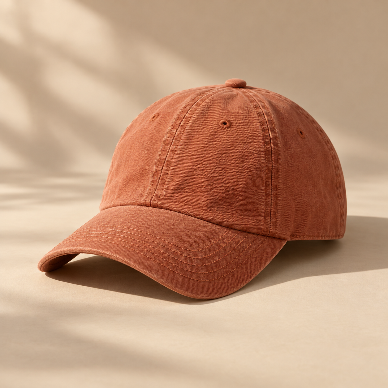 one washed terracotta cotton baseball cap, curved brim, subtle stitching, three-quarter angle