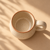 Studio Mug — top-down view showing the ivory glazed interior and terracotta rim, empty mug