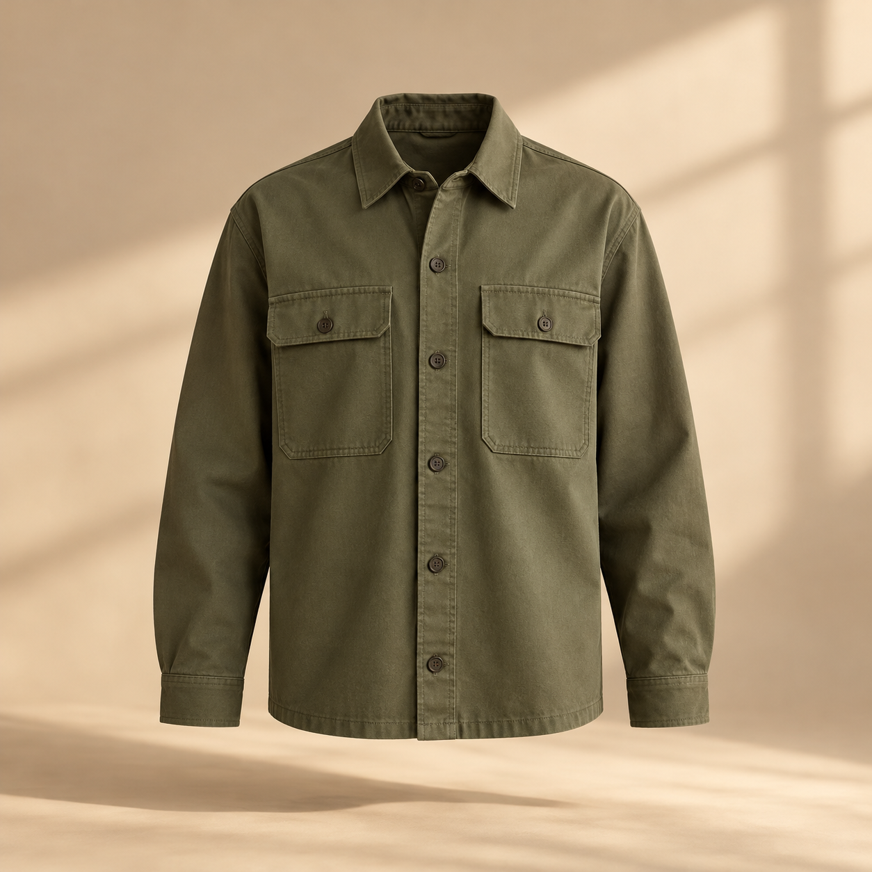 one premium olive cotton twill overshirt with two square chest pockets, tonal buttons and relaxed tailored silhouette, invisible mannequin full front view, no person